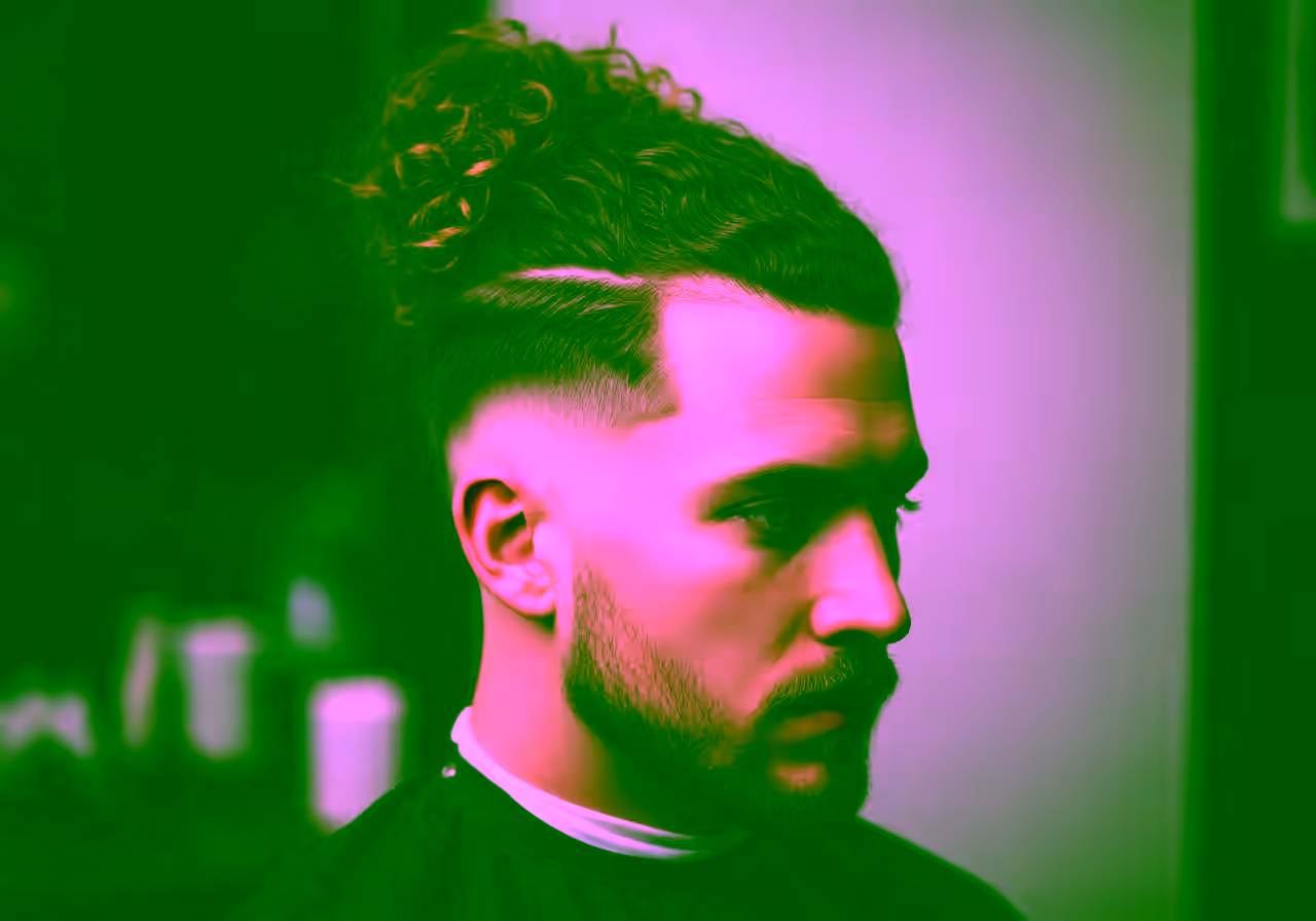 Curly Man Bun — curly hairstyle for men in 2026
