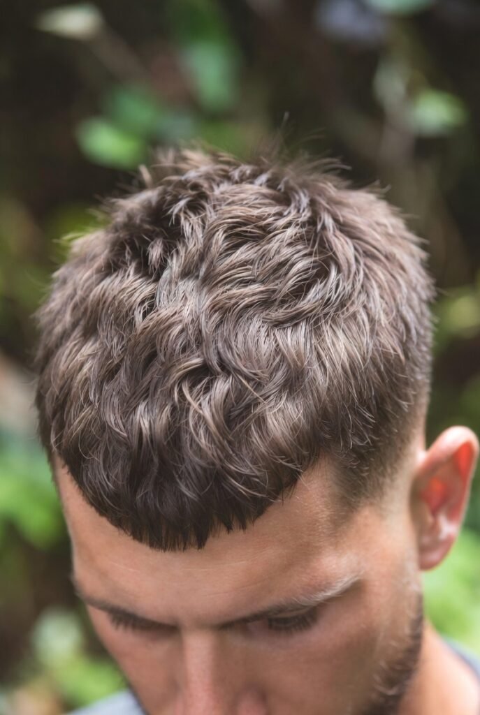 Eco-textured buzz cut for men – sustainable natural oils experimental shine