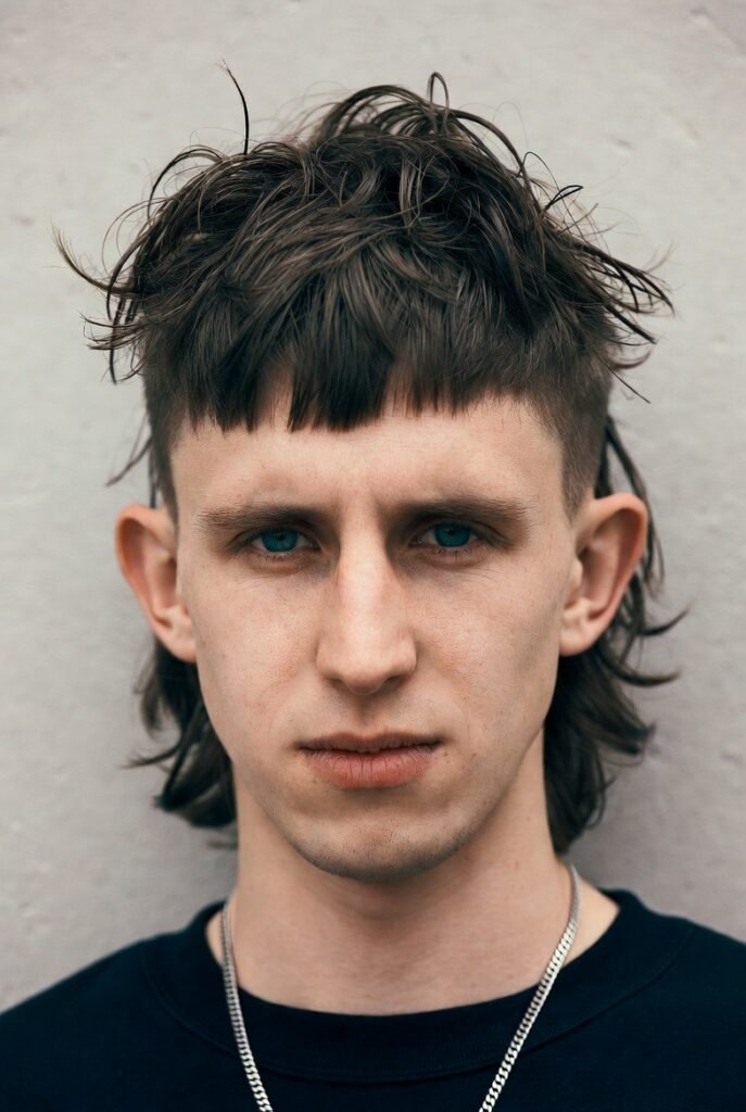 Reverse crew cut for men – #5 long top buzzed sides, heart flip.